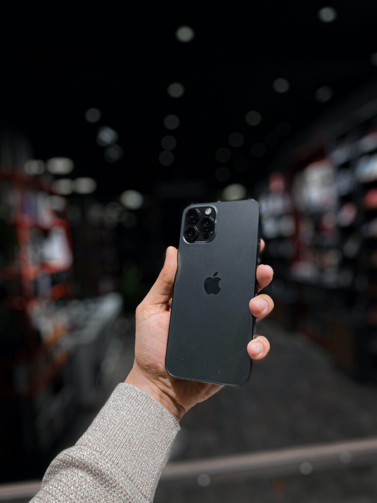 "A close-up of the iPhone 14 Pro Max smartphone, showing the front and rear cameras."
